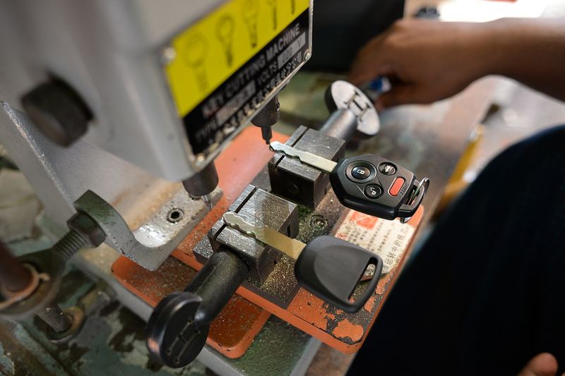 Car key being cut on a key duplication machine