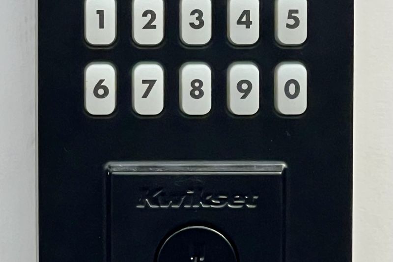 Electronic keypad deadbolt with a key cylinder